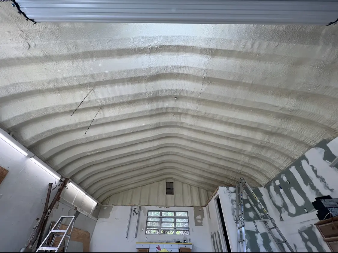 Spray polyurethane foam applied to the underside of a metal roof deck in Camas